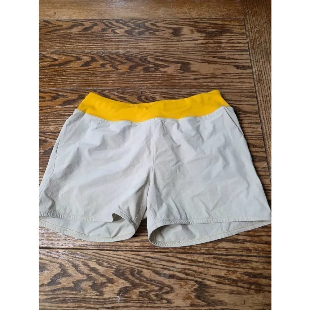 Cotopaxi Women's Vamos Hybrid Short in cream/yellow sz Small